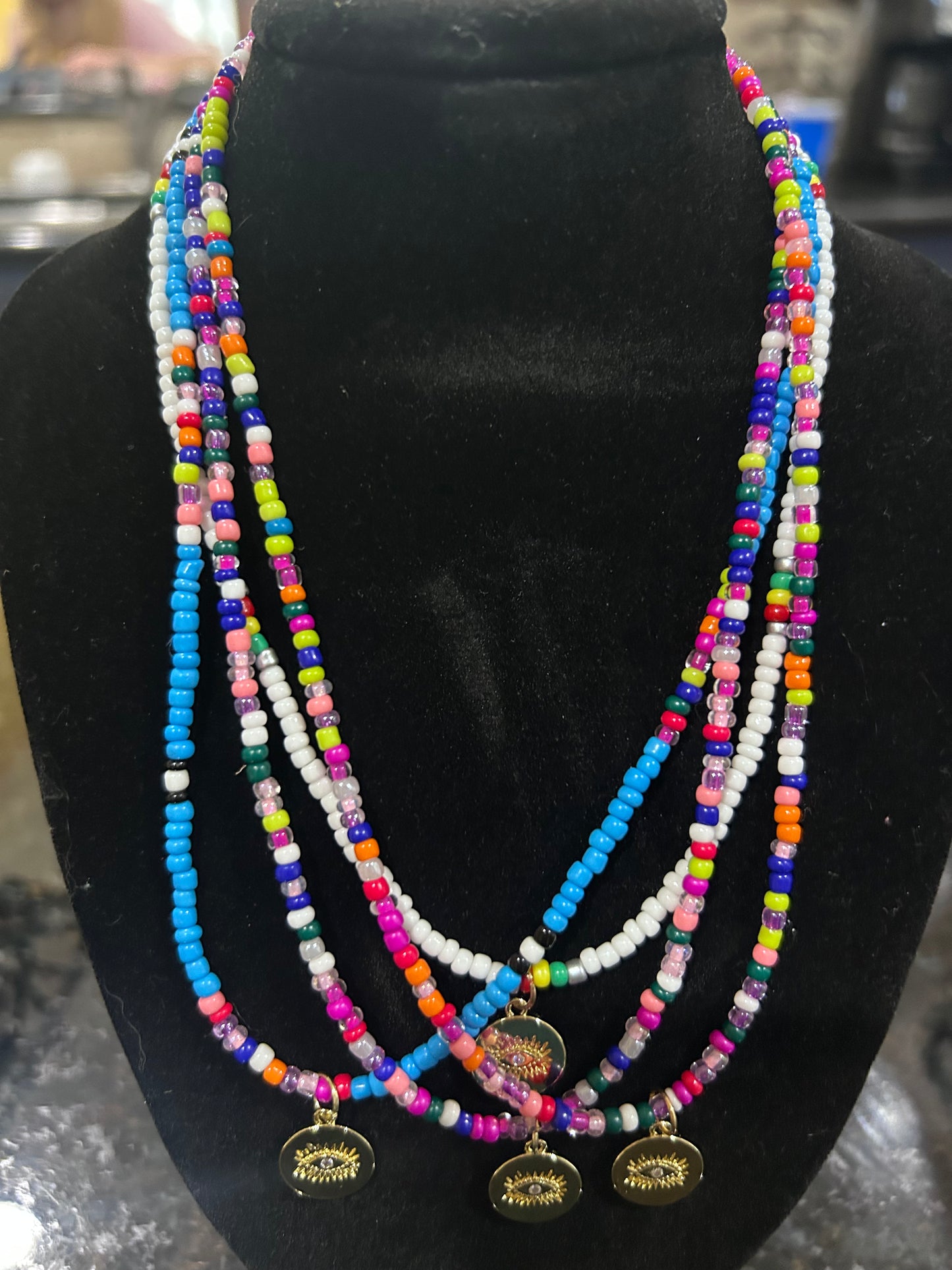 Boho Multi Colored Seed Beaded Necklace with Gold Evil Eye Pendant