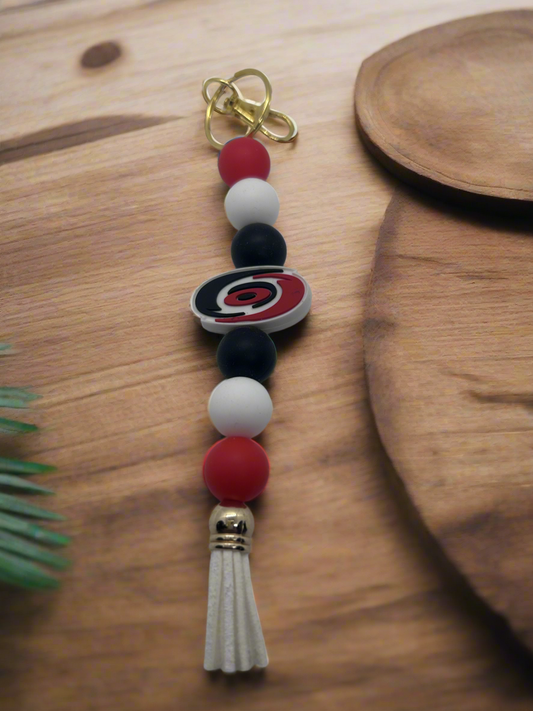 Carolina Hurricanes inspired beaded keychain with tassel