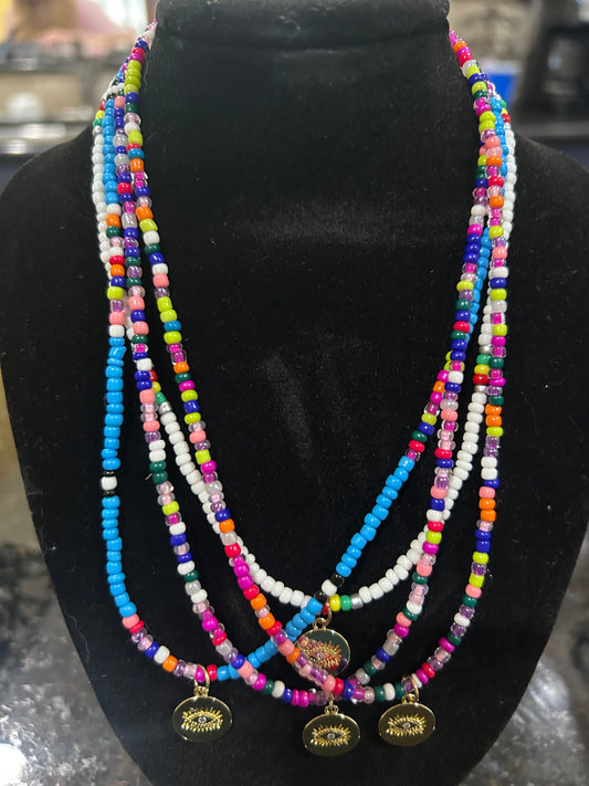 Boho Multi Colored Seed Beaded Necklace with Gold Evil Eye Pendant