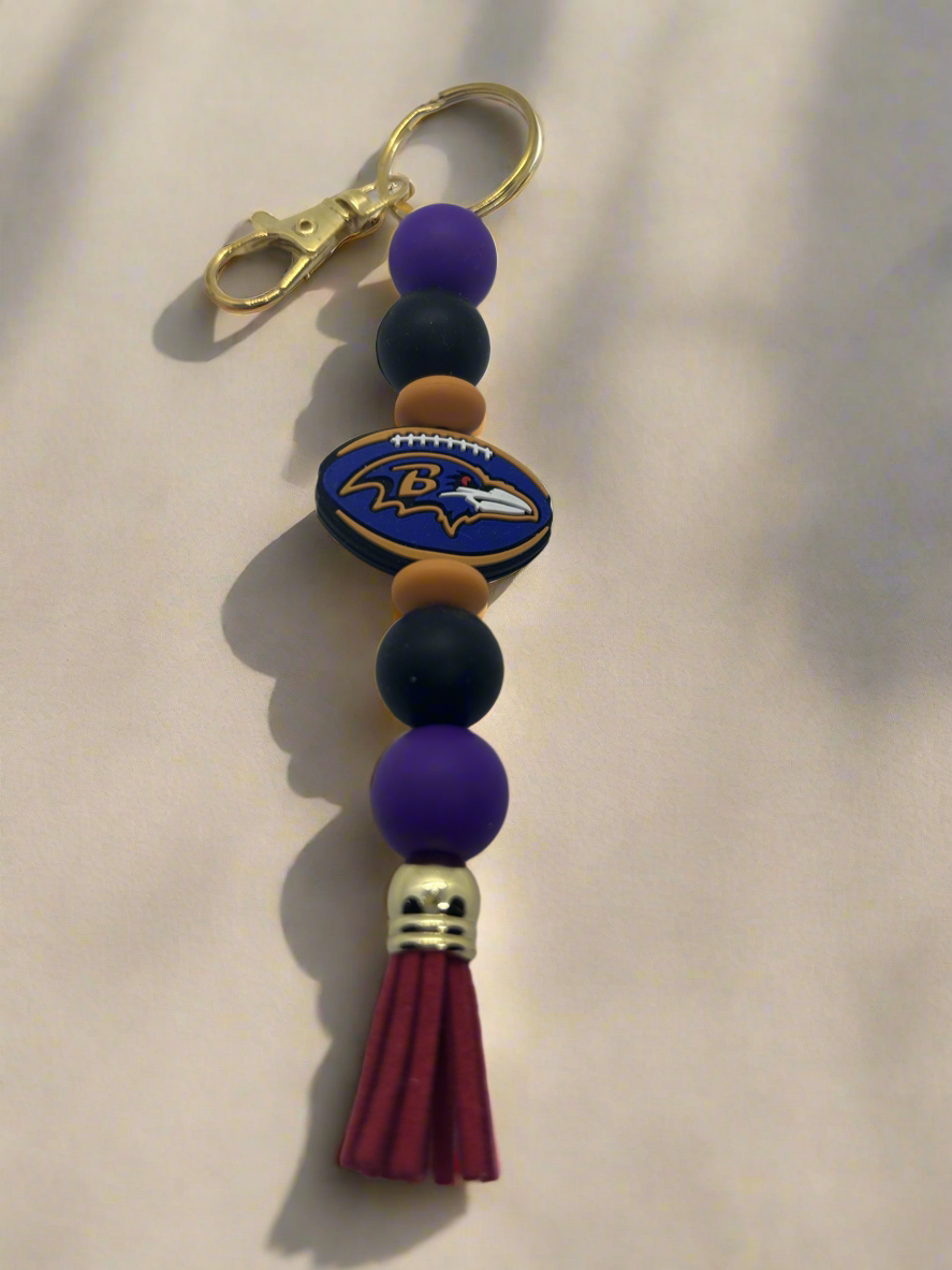 Baltimore Ravens inspired beaded keychain with gold clip and tassel